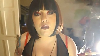 Chubby Female Superior Tina Smua Puffs On A Unfiltered Cigarette Using A Holder